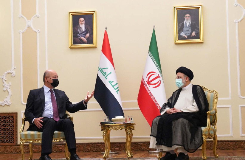  Iraq's President Barham Salih meets with Iran's new President Ebrahim Raisi in Tehran, Iran August 5, 2021. (photo credit: Presidency of the Republic of Iraq Office/Handout via REUTERS)