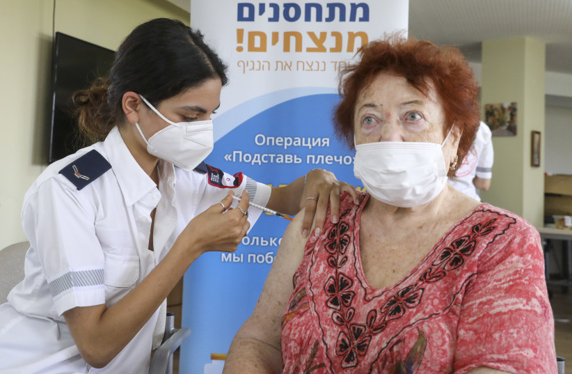     Third dose of vaccine administered at Amigdor retirement home by Magen David Adom (MDA), Jerusalem, August 5, 2021. (MARC ISRAEL SELLEM)