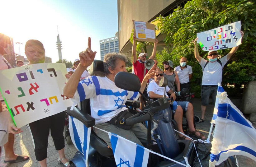 Disability Rights activists block Ayalon Highway to protest new state budget, August 5, 2021 (credit: AVSHALOM SASSONI/MAARIV)