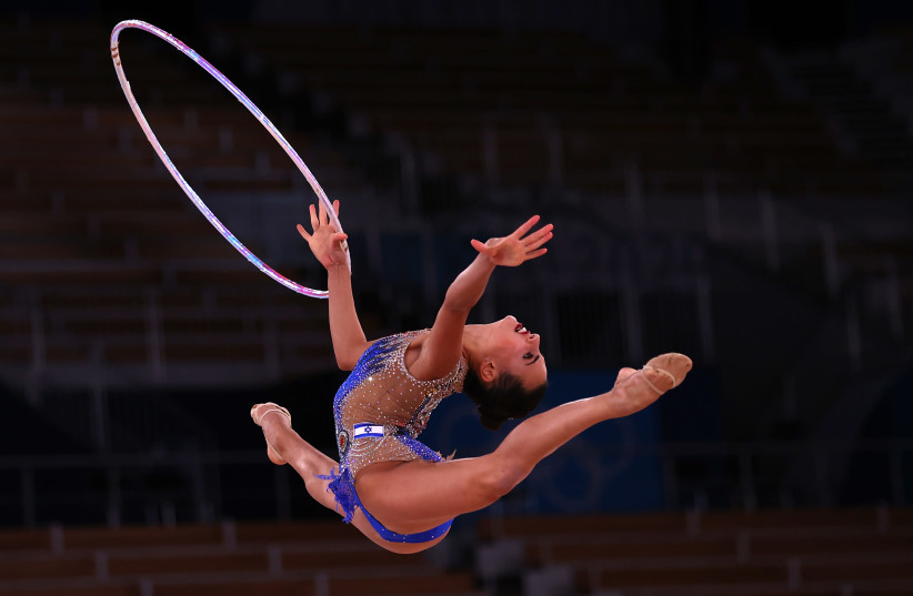 Tokyo 2020 Olympics - Gymnastics - Rhythmic - Individual All-Around - Final - Rotation 1 - Ariake Gymnastics Centre, Tokyo, Japan - August 7, 2021. Linoy Ashram of Israel in action with hoop (credit: REUTERS/LISI NIESNER)