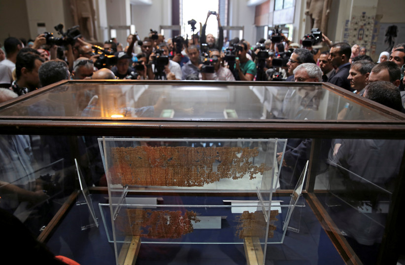  Members of the media record Papyrus of King Khufu at the opening exhibition of 'The Papyri of Khufu from Wadi al-Jarf' for the first time at the Egyptian Museum in Cairo (photographer: REUTERS/MOHAMED ABD EL GHANY)