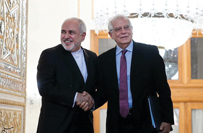 IRANIAN FOREIGN Minister Javad Zarif shakes hands with Josep Borrell, EU high representative for foreign affairs and security policy, in Tehran last year. (credit: TASNIM NEWS AGENCY/REUTERS)