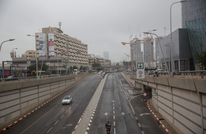 The empty roads in Tel Aviv on March 17, 2020. The government ordered all bars, restaurants and malls to close in an effort to contain the spread of the coronavirus. Most people have started to work from home.  (photo credit: MIRIAM ALSTER/FLASH90)