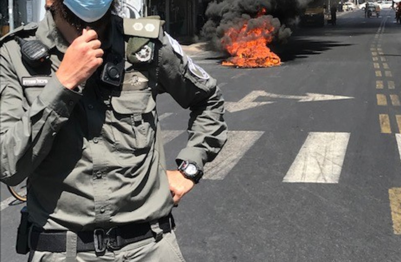 Protests against a possible lockdown on Eilat Street in Tel Aviv, August 10, 2021. (credit: DAVID GRUNBERG )