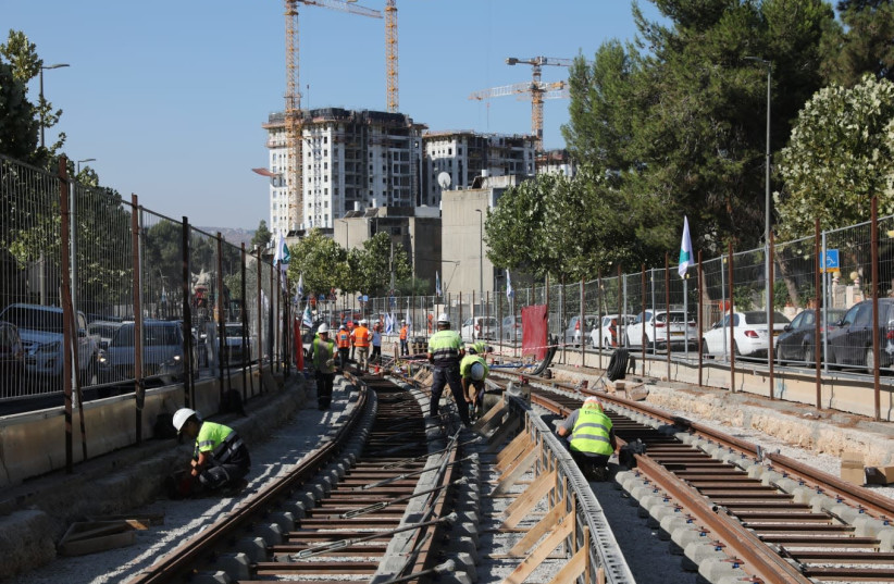 The expansion of the light rail red line begins with the laying of the first tracks (credit: ABIR SULTAN)
