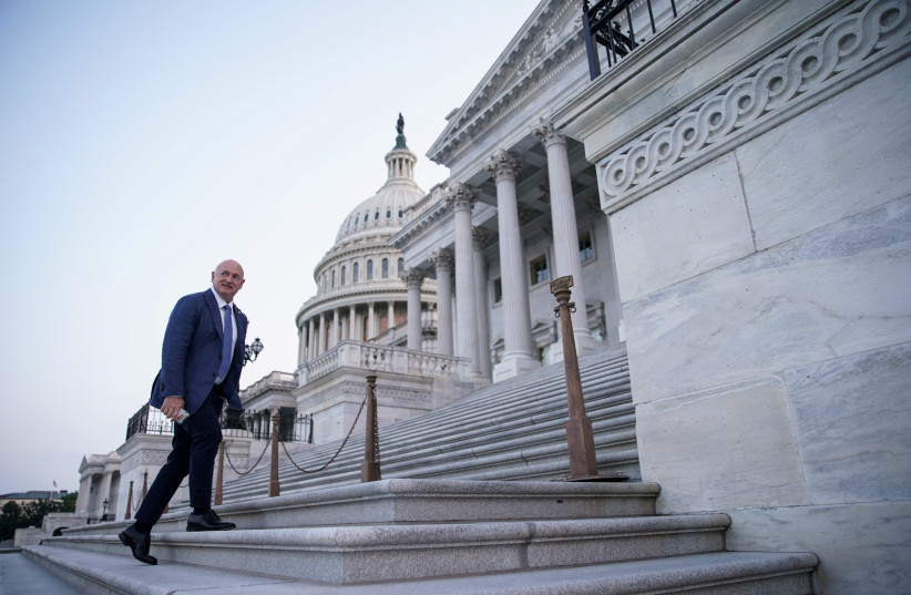  Senator Mark Kelly arrives at the US Capitol to vote as the Senate works to advance the bipartisan infrastructure bill in Washington, US, August 8, 2021.  (photo credit: REUTERS/SARAH SILBIGER)