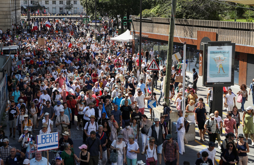  Protesters attend a demonstration called by the French nationalist party ''Les Patriotes'' (The Patriots) against France's restrictions, including a compulsory health pass, to fight the coronavirus disease (COVID-19) outbreak, in Paris, France, August 14, 2021 (credit: REUTERS/SARAH MEYSSONNIER)