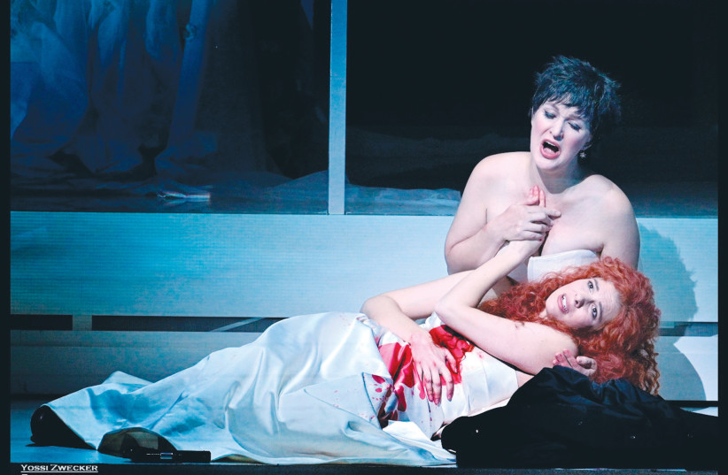  ALLA VASILEVITSKY (sitting) and Tal Bergman play Giulietta and Romeo, respectively, at the Israeli Opera production of Bellini’s ‘I Capuleti ed i Montecchi’. (credit: YOSSI ZWECKER)