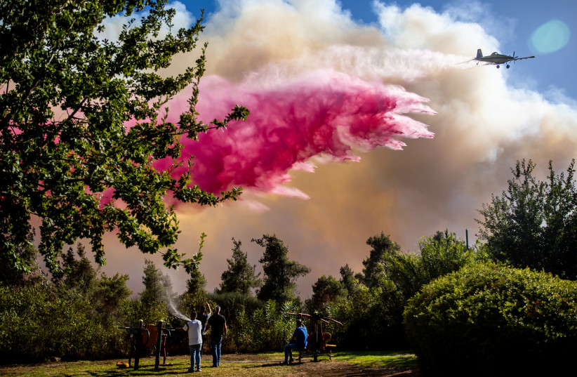  Israeli firefighters and citizens try to extinguish a fire which broke out in a forest near near Beit Meir, outside of Jerusalem on  August 15, 2021.  (credit: YONATAN SINDEL/FLASH90)