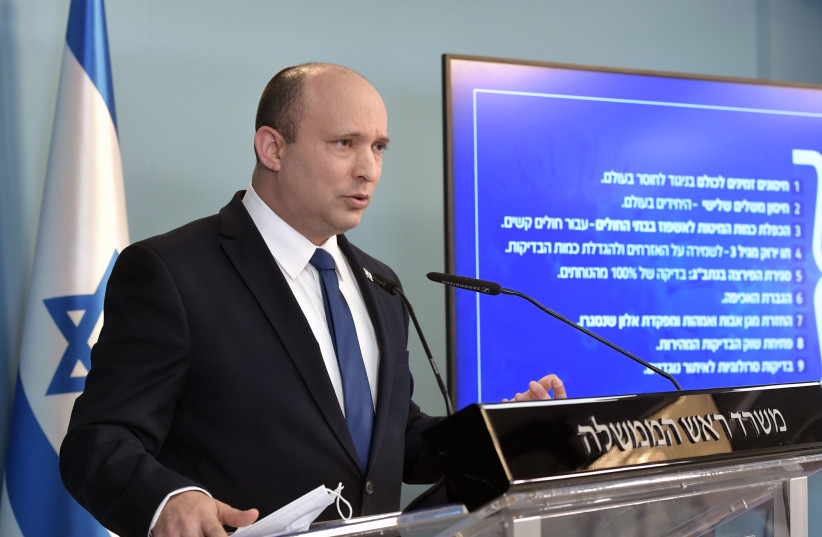  Israel's Prime Minister Naftali Bennett is seen speaking at a press conference, on August 18, 2021. (credit: KOBI GIDEON/GPO)