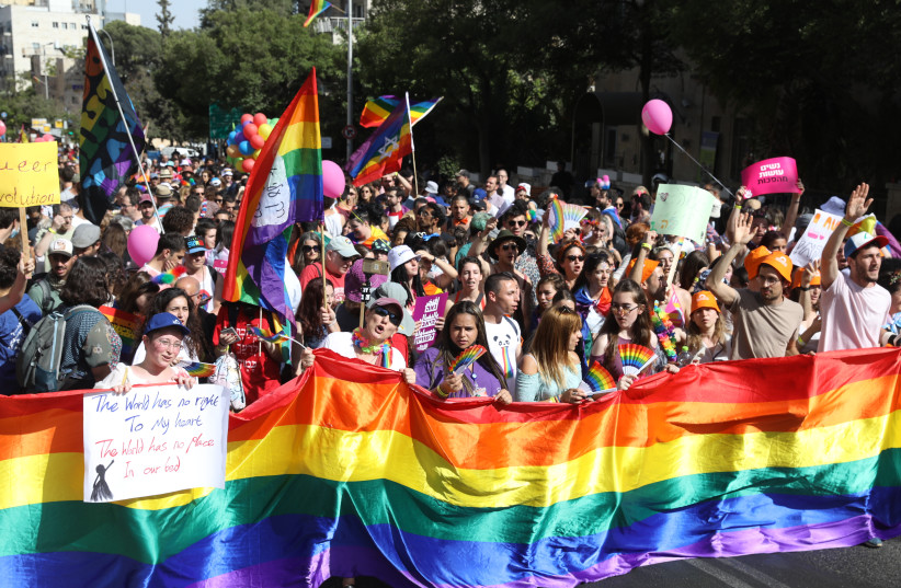  People take part in a rally marking the annual Gay Pride Parade in Jerusalem, on June 3, 2021.  (photo credit: NOAM REVKIN/FLASH90)