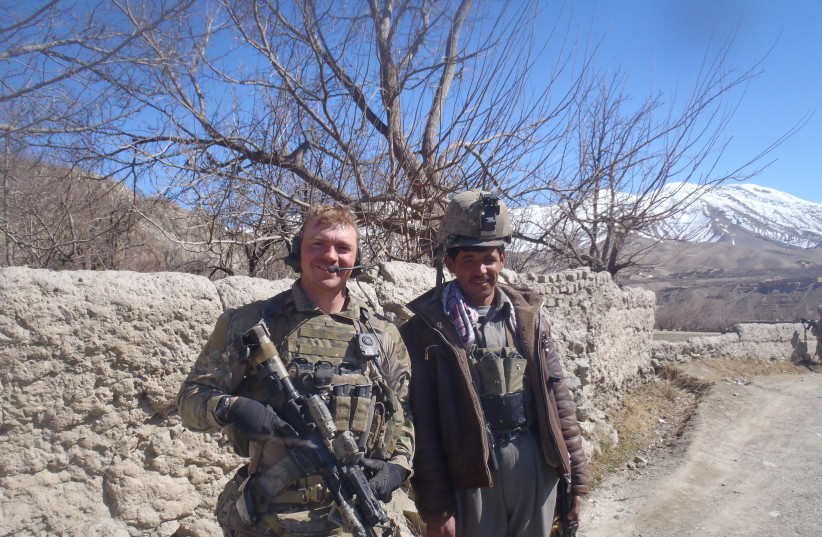  Graham Platner is seen alongside a member of the Afghan National Police. (credit: Courtesy of Graham Platner)