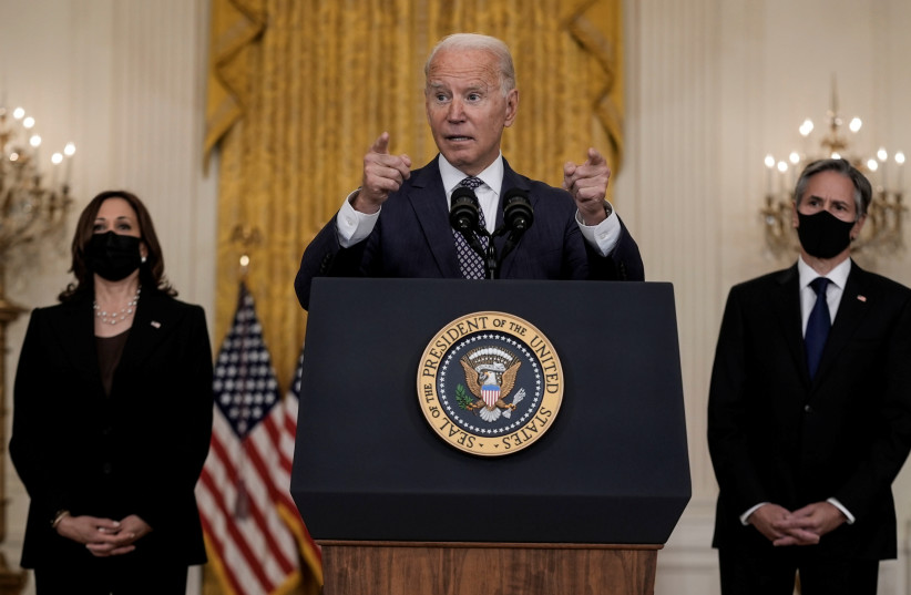  U.S. President Joe Biden delivers remarks on evacuation efforts and the ongoing situation in Afghanistan as Vice President Kamala Harris and Secretary of State Antony Blinken stand by in the East Room at the White House in Washington, US, August 20, 2021.  (credit: REUTERS/KEN CEDENO)
