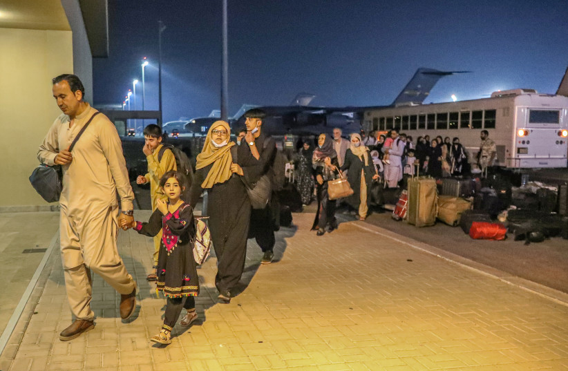  Evacuees from Afghanistan arrive at Al-Udeid airbase in Doha, Qatar in this recent undated handout. (credit: REUTERS)