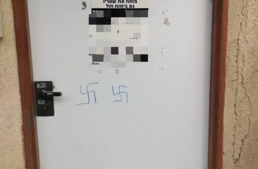  Swastikas scrawled on the door of a Tel Aviv synagogue (credit: ISRAEL POLICE)