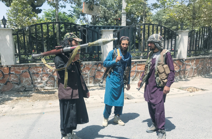  TALIBAN FORCES stand guard inside Kabul earlier this month.  (credit: REUTERS)