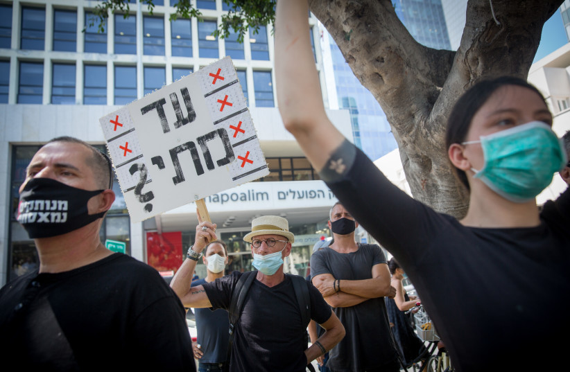  Israeli self-employed protest the lack of financial support from the Israeli government in times of Corona, when many find themselves unemployed, on Rothschild Boulevard in Tel Aviv, July 7, 2020.  (credit: MIRIAM ALSTER/FLASH90)