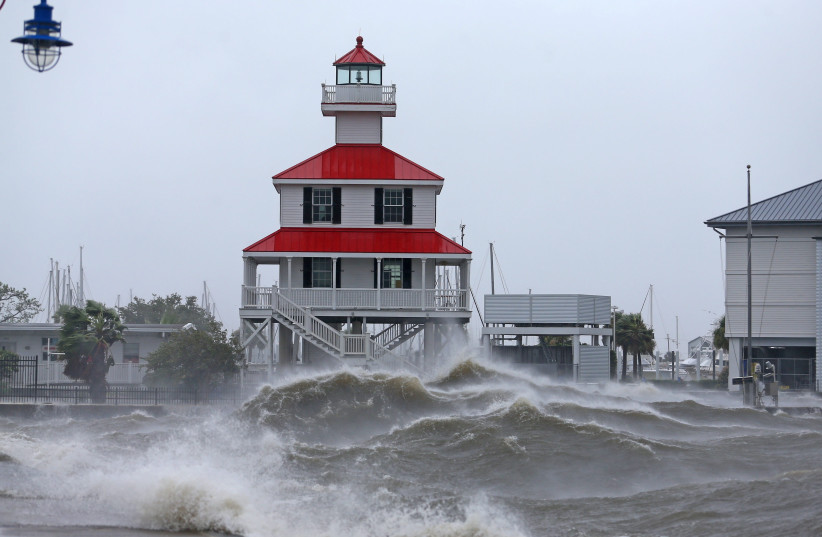  Waves crash against the New Canal Lighthouse on Lake Pontchartrain (credit: MICHAEL DEMOCKER/USA TODAY/VIA REUTERS)