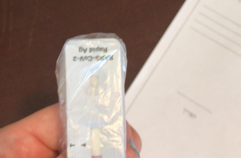  One parent saved her daughter's negative test strip in a plastic bag, unsure of how to deliver the negative result to school on Wednesday. (credit: Courtesy)