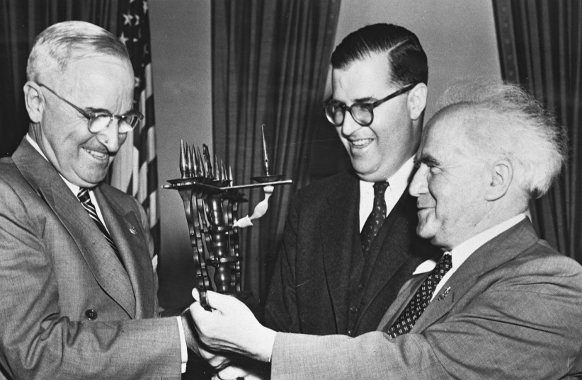  US president Harry Truman receives a Hannukkiah from Israel's first prime minister, David Ben-Gurion, as Abba Eban looks on, 1951 (photo credit: FRITZ COHEN/GPO)