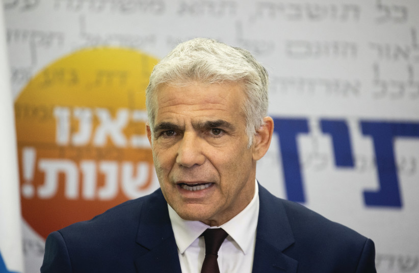  ALTERNATE PRIME Minister Yair Lapid addresses his Knesset faction in July against the backdrop of his party slogan: ‘We came to change.’ ( (photo credit: YONATAN SINDEL/FLASH90)