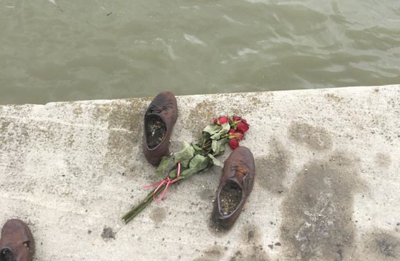  Memorial of bronze shoes in Budapest on the bank of the Danube, commemorating Hungarian Jews killed in the Holocaust (credit: MICHAEL STARR)