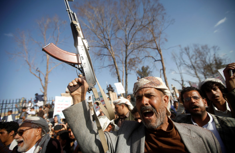  A man chants slogans as he and supporters of the Houthi movement attend a rally to celebrate following claims of military advances by the group near the borders with Saudi Arabia, in Sanaa, Yemen October 4, 2019. (photo credit: MOHAMED AL-SAYAGHI/REUTERS)