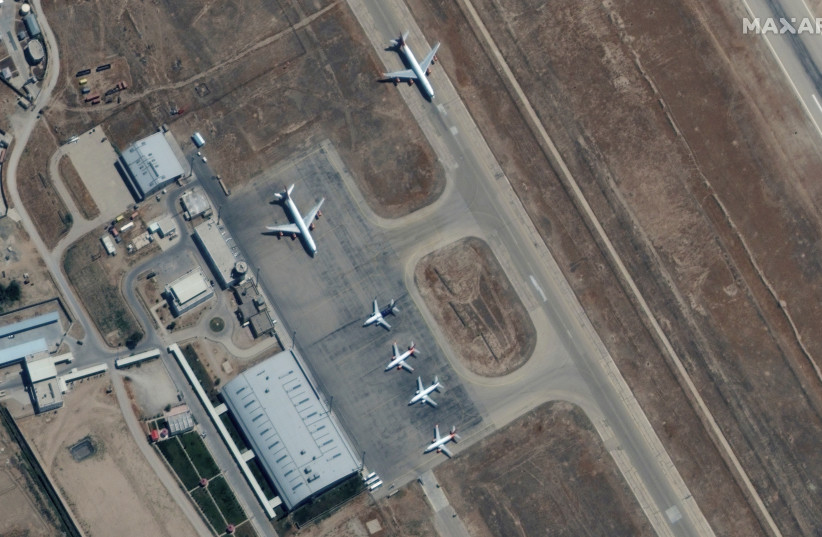 Six commercial airplanes are seen near the main terminal of the Mazar-i-Sharif airport, in northern Afghanistan, September 3 2021. (credit: MAXAR TECHNOLOGIES/HANDOUT VIA REUTERS)