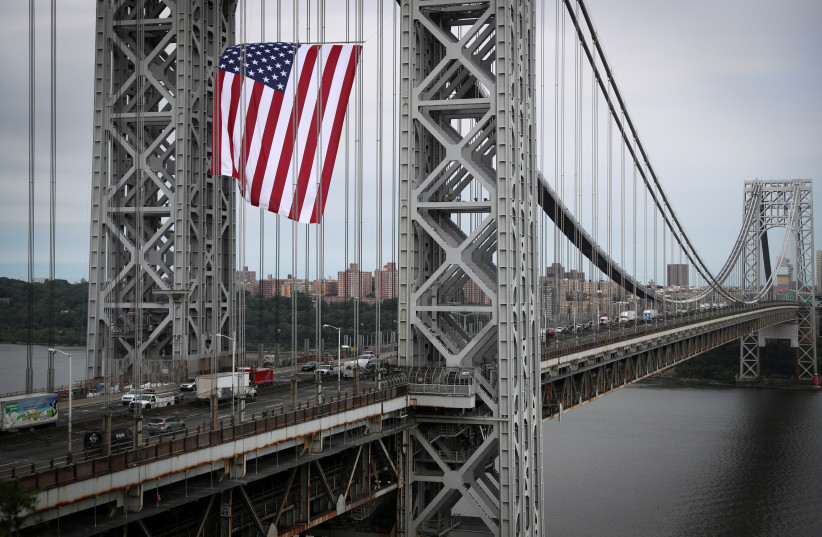     A giant American flag flies over the George Washington Bridge on Flag Day on June 14.  (Credit: Mike Seger / Reuters)