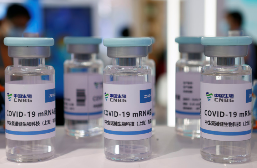  Vials representing the mRNA coronavirus disease (COVID-19) vaccine candidate developed by Sinopharm's China National Biotec Group (CNBG) are seen displayed at its booth at the 2021 China International Fair for Trade in Services (CIFTIS) in Beijing, China September 3, 2021. (credit: REUTERS/FLORENCE LO)