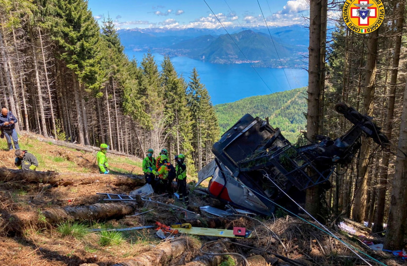  A crashed cable car is seen after it collapsed in Stresa, near Lake Maggiore, Italy May 23, 2021. (credit: ALPINE RESCUE SERVICE/HANDOUT VIA REUTERS)