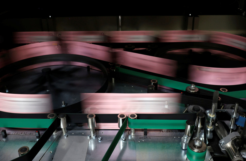  Mail-in ballots move through an automated sorting machine at the Sacramento Registrar of Voters as California goes to the polls in a gubernatorial recall election allowing the voting public to remove current governor Gavin Newsom and replace him with one of 46 candidates, in Sacramento, California, (credit: REUTERS/FRED GREAVES)