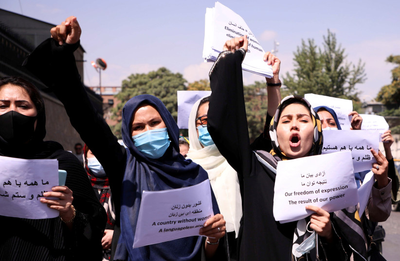  Afghan women's rights defenders and civil activists protest to call on the Taliban for the preservation of their achievements and education, in front of the presidential palace in Kabul (photo credit: REUTERS/STRINGER)