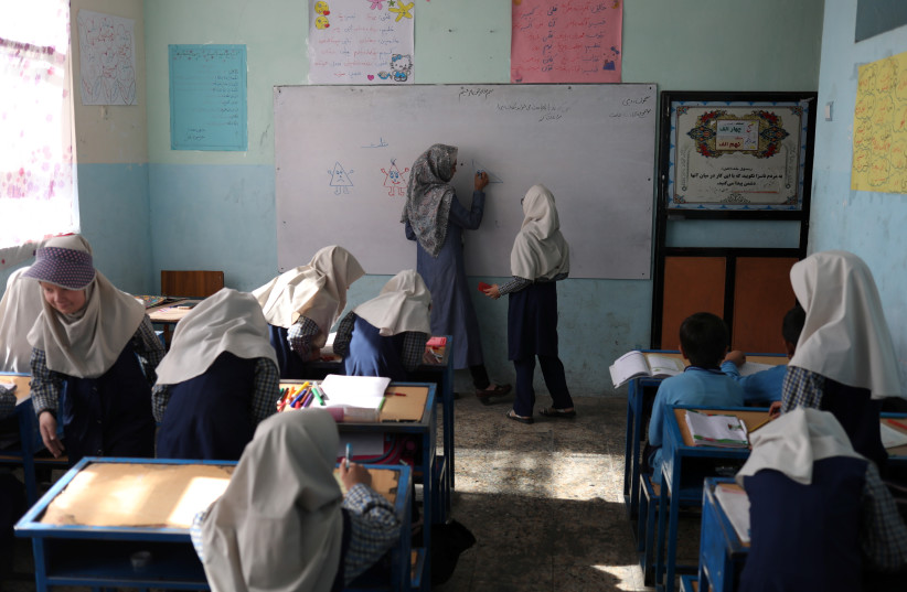  Afghan girls attend a class at a school in Kabul, Afghanistan, September 18, 2021. (photo credit: WANA (WEST ASIA NEWS AGENCY) VIA REUTERS)
