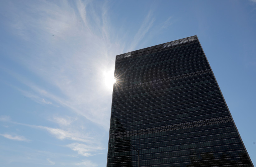  The sun shines behind the United Nations Secretariat Building at the United Nations Headquarters. New York City, New York, U.S., June 18, 2021.  (photo credit: REUTERS/ANDREW KELLY/FILE PHOTO)