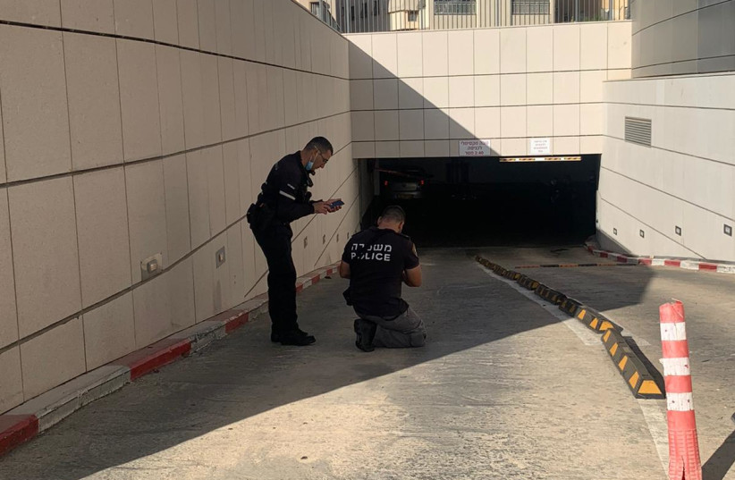     Police outside the parking lot where a car collided with a wall on September 19, 2021.  (Credit: Police Spokesperson Unit)