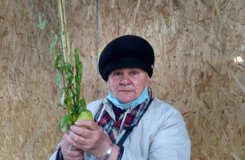  A Jewish woman in Khazakstan holding the Four Species ahead of Sukkot.  (credit: ALLIANCE OF THE RABBIS IN ISLAMIC STATES)