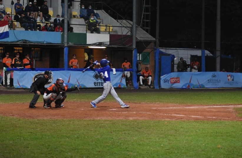 Assaf Lowengart (24) launched a two-run moonshot to put Israel ahead 4-1, giving Israel hopes of an upset. Lowengart led all tournament players with four home runs. (credit: ISRAEL ASSOCIATION OF BASEBALL/ COURTESY)