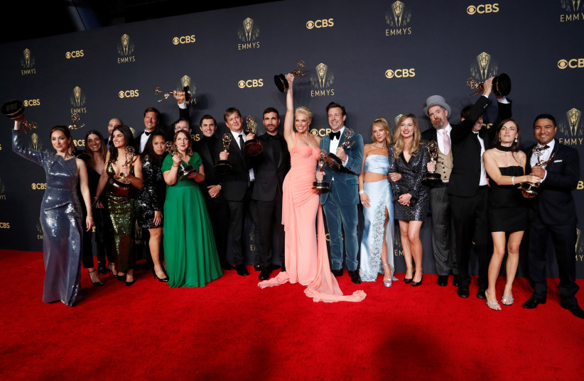  The cast and crew members of comedy series ''Ted Lasso'' pose for a picture with their awards at the 73rd Primetime Emmy Awards in Los Angeles, US, September 19, 2021 (credit: REUTERS/MARIO ANZUONI)