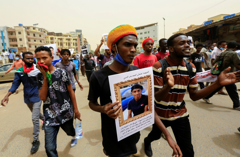  Sudanese take part in a march against the Rapid Support Forces, who they blame for a raid on protesters who had camped outside the defense ministry during the 2019 revolution, in Khartoum, Sudan, June 3, 2021. (credit: REUTERS/MOHAMED NURELDIN ABDALLAH)