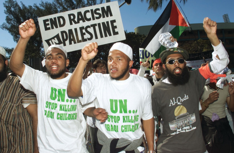  DEMONSTRATORS PROTEST outside the World Conference Against Racism (WCAR) in Durban, South Africa, in 2001. (photo credit: MIKE HUTCHINGS / REUTERS)