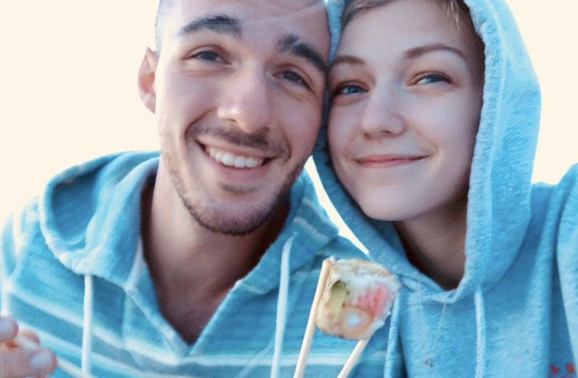  Gabrielle Petito, 22, who was reported missing on September 11, 2021 after traveling with her boyfriend around the country in a van and never returned home, poses for a photo with Brian Laundrie in this undated handout photo. (photo credit: North Port/Florida Police/Handout via REUTERS)