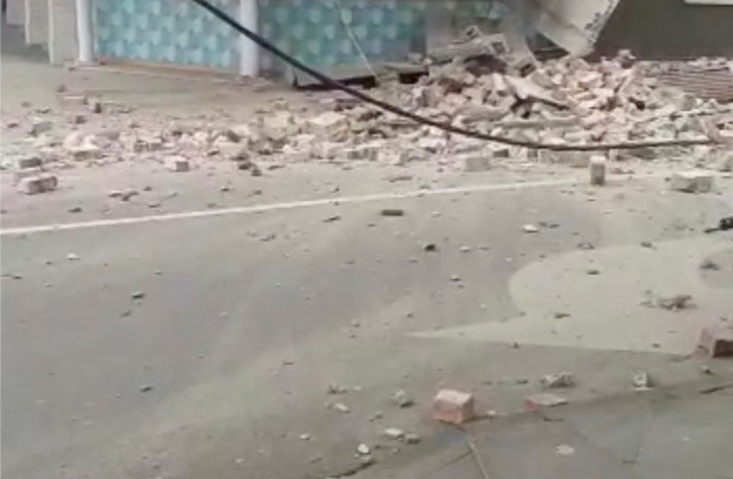  Debris and a damaged building are seen in Prahran, after a magnitude 6.0 earthquake struck near Melbourne, Victoria, Australia, September 22, 2021, in this still image from video obtained via social media.  (credit: TOM ROBERTSON VIA REUTERS)