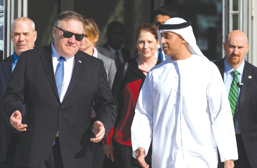  THEN-US SECRETARY of State Mike Pompeo speaks with the Emirati Ambassador to the US Yousef Al Otaiba in Abu Dhabi, in 2019 (photo credit: ANDREW CABALLERO-REYNOLDS/REUTERS)