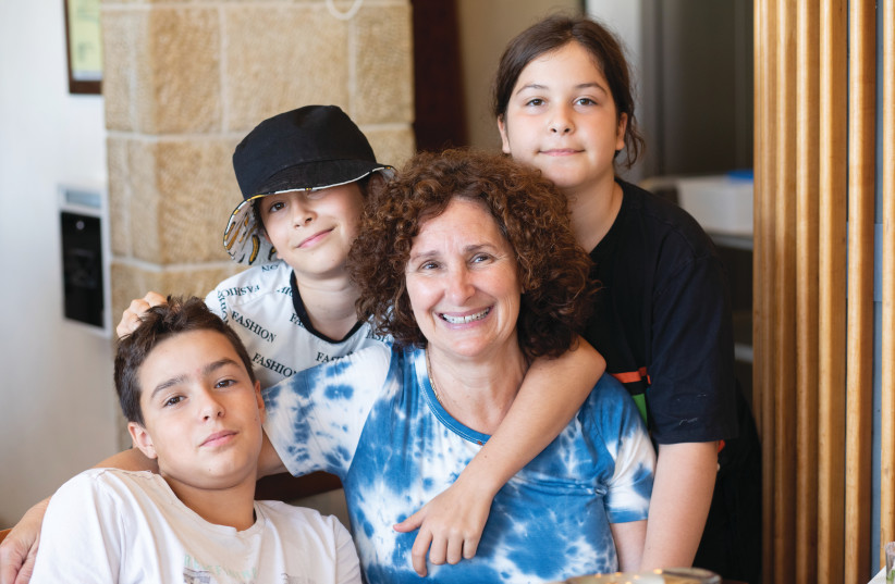  Photo: Laura Cornfield with her children Matan, Hila and Tal. (photo credit: Avigail Piperno-Beer)