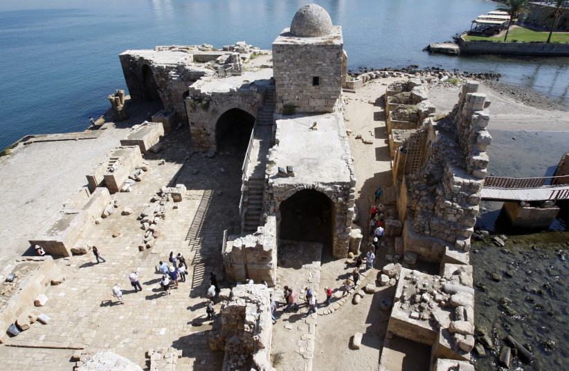 Tourists walk at the sea castle of the port-city of Sidon, southern Lebanon October 3, 2011.  (photo credit: REUTERS/ALI HASHISHO)