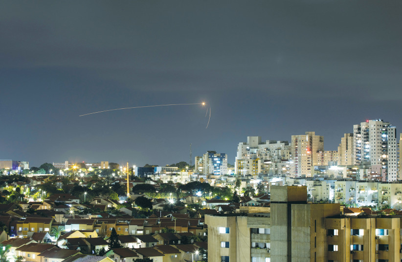  STREAKS OF LIGHT are seen from Ashkelon as the Iron Dome intercepts a rocke launched from the Gaza Strip on September 11. (photo credit: AMIR COHEN/REUTERS)