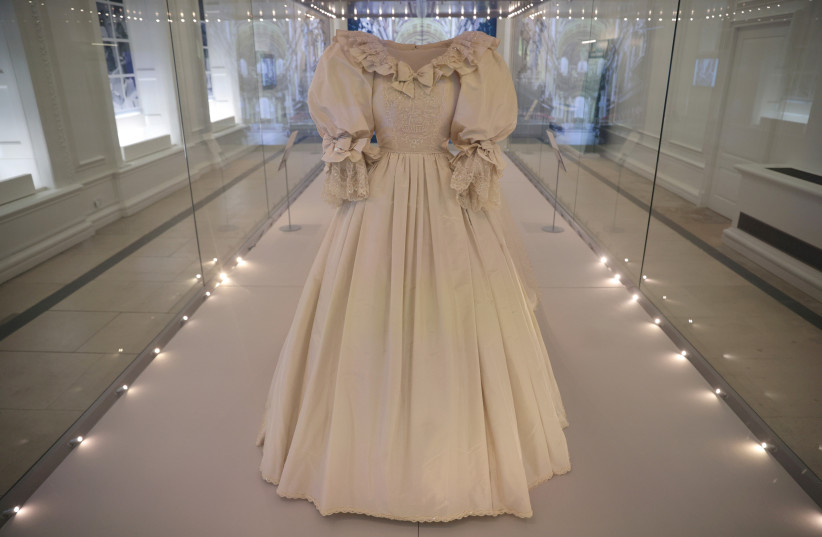  THE WEDDING DRESS worn by Diana, Princess of Wales, displayed at Kensington Palace in London this summer.  (credit: HANNAH MCKAY/ REUTERS)