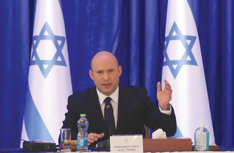  PRIME MINISTER Naftali Bennett attends a cabinet meeting earlier this month. (photo credit: ABIR SULTAN / REUTERS)