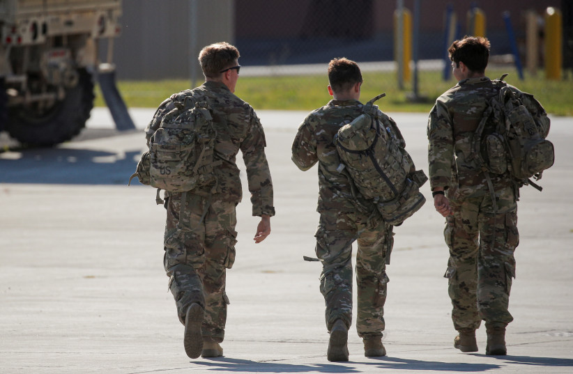  Soldiers from the 4th Battalion, 31st Infantry Regiment, 2nd Brigade Combat Team of the 10th Mountain Division, walk together after returning home from deployment in Afghanistan, at Fort Drum, New York, US, September 6, 2021. (photo credit: REUTERS/BRENDAN MCDERMID/FILE PHOTO)